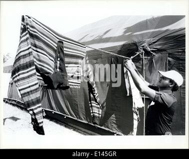 Apr. 04, 2012 - A Cuban refugee hangs up cloths to dry in the tent at Fort Walton Beach fairgrounds. Stock Photo
