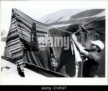 Apr. 04, 2012 - A Cuban refugee hangs up cloths to dry in the tent city at Fort Walton Beach fairgrounds/Eglin Air Base. Stock Photo