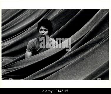 Apr. 04, 2012 - A Cuban refugee sits in his cot while being enclosed by blankets that were strung from the end of the cots to a Stock Photo