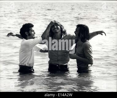 Apr. 17, 2012 - ''Jesus Revolution'' By The ''Children Of God'': Hallelujah: A convert about to be immersed in the English Channel by Brother Abraham and a helper. Stock Photo