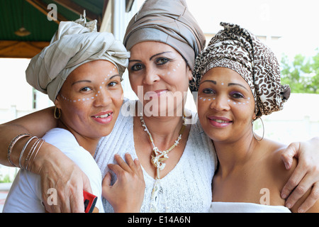 Mixed race women wearing turban Stock Photo