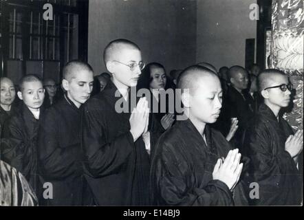 Apr. 17, 2012 - U.S. Women Become Buddhist Nuns: Two young American women become Buddhist nuns after having their heads shaved for the initiation ceremony at a Buddhist temple in Taipei, Taiwan, as they pray with a group of Chinese nuns undergoing the ceremony of vows to follow the teachings of Buddha. The noviates are second and third from the right in the front line. Stock Photo