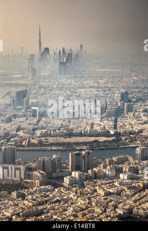United Arab Emirates, Dubai, Old city center. Background financial center and Burj Khalifa, highest building in world. Aerial Stock Photo