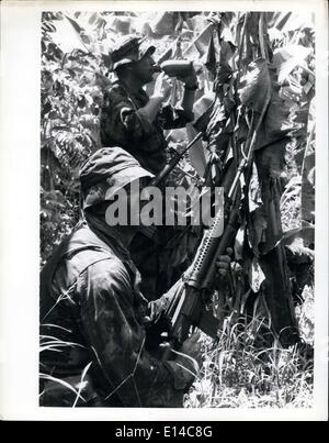 Apr. 17, 2012 - Phi Dan Dodd; Republic of Vietnam Two US Navy Seals (Sea, Air and Land) pause briefly for a drink of water during operation Crimson Tide, a pre-planned operation in Vinh Binh province 67 miles South West of Saigon. Seals are counter guerilla experts, highly trained in unconventional warfare and Para military operations. This operation resulted in five enemy guerillas killed, and 153 camouflaged structures and fortifications 120 Sampans and 75 destroyed. Stock Photo