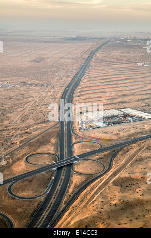 United Arab Emirates, Dubai, Highway in desert. Aerial Stock Photo