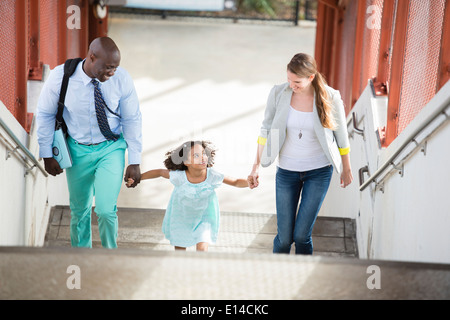 Family walking up stairs Stock Photo