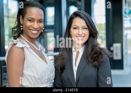 Businesswomen smiling outdoors Stock Photo