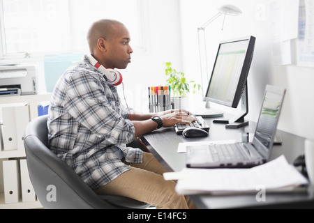 Black businessman working in office Stock Photo