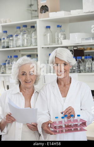 Senior Caucasian scientists working in lab Stock Photo