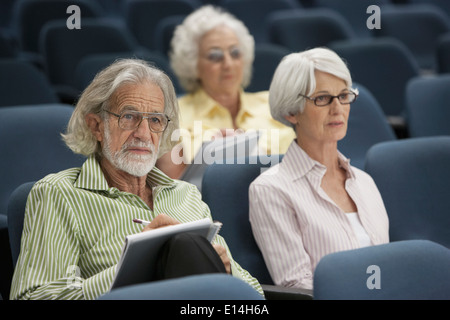 Senior Caucasian students sitting in classroom Stock Photo
