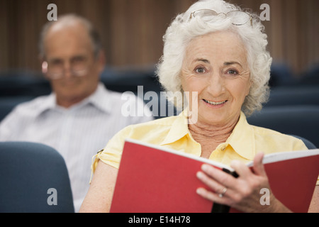 Senior Caucasian students sitting in classroom Stock Photo
