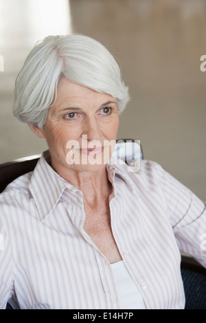 Pensive senior Caucasian woman Stock Photo
