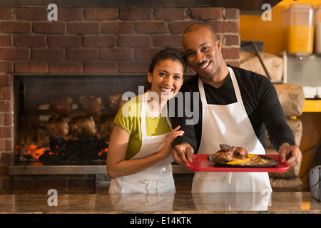 Couple working together in restaurant Stock Photo