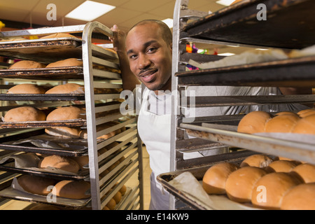 Black baker working in commercial kitchen Stock Photo