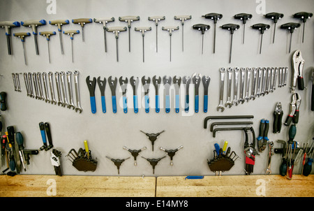 Tools arranged neatly on shop wall Stock Photo