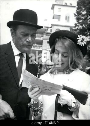 Apr. 09, 2012 - The Jockey-Club Prize in Chantilly attracted lots of celebrities and movie stars. Among theme was Eddie Constantine, who was accompanied by his wife, observing the horses with lots of interest, something he comes by easily, since he himself also owns some stables. Stock Photo