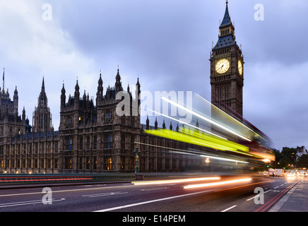 Long exposure of bus passing Houses of Parliament, London, United Kingdom Stock Photo