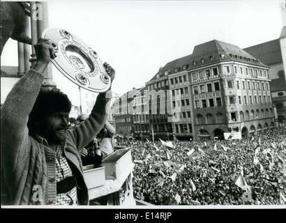 Apr. 18, 2012 - Jubilation and turbulence surrounded the new German football champion FC Bayern Muchen: First about 73,000 visitors celebrated enthusiastically the successful team after the 2:1 win over Eintracht b raunschweig in the last game of the football Bundesliga season. Then at Saturday evening May 31st, 1980 10,000 fans came to the Munich/West Germany Marienplatz in front of the town hall to give the players a sensational welcome. The mayor of Munich presents the captain of the football team of FC Bayern Munchen a great cup Stock Photo