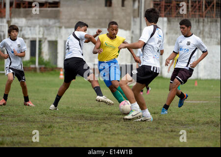 Street children playing a friendly soccer match against a youth team, preparation for the Street Children World Cup 2014 Stock Photo