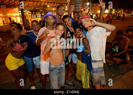 Group of street children at night in the square in front of the Central do Brasil railway station in the centre of Rio de Stock Photo