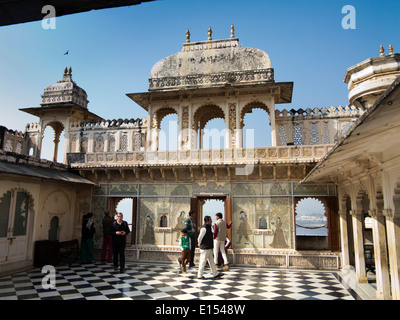 India, Rajasthan, Udaipur, City Palace visitors enjoying views across Lake Pichola Stock Photo