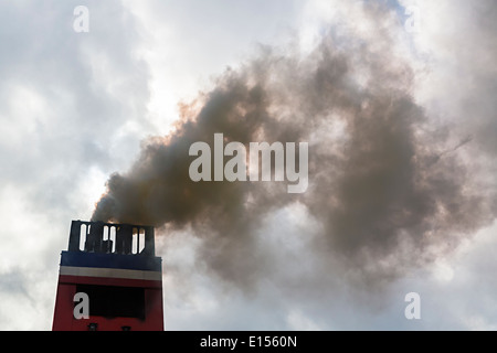 Dark smoke emitted from Irish ferry Stock Photo