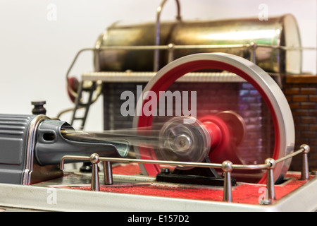 Close up of a spinning flywheel of a steam engine Stock Photo