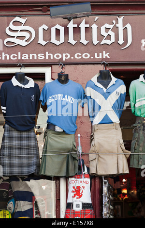 Kilts and tartan outside a Scottish souvenir shop on the Royal Mile, Edinburgh Stock Photo