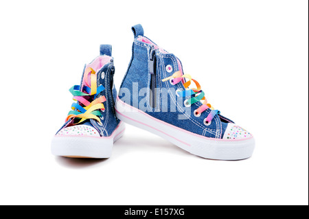 Blue jeans sneakers with rainbow laces isolated on white Stock Photo