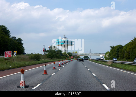 roadworks closed lane and pennine tower of lancaster forton services M6 motorway lancashire uk Stock Photo
