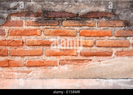 Abstract red brick wall of old decaying erosion. Stock Photo