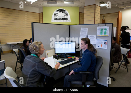 Community volunteer for local nonprofit group signs up clients for health insurance under the Affordable Care Act in Austin TX Stock Photo