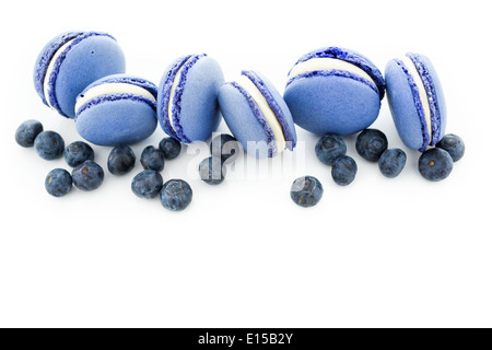 Gourmet small colorful French macarons with blueberry flavor. Stock Photo