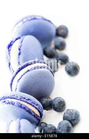 Gourmet small colorful French macarons with blueberry flavor. Stock Photo