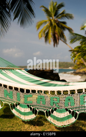 hammock with palm coconut trees on Caribbean Sea at Casa-Canada resort Corn Island Nicaragua Central America Stock Photo