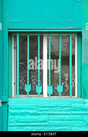 Make do window bar security using metal fence post in downtown Portland Oregon Stock Photo