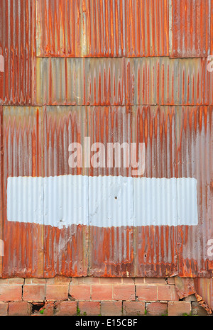 rusted corrugated metal wall of a warehouse building in a industrial district of Portland Oregon Stock Photo