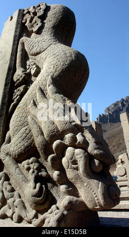 (140523) -- ZHENGZHOU, May 23, 2014 (Xinhua) -- Photo taken on March 23, 2012 shows a stone fender pillar with dragon sculpture at the Taiping Temple in Qinyang, central China's Henan Province. A large number of architectural sculptures have been preserved in historical sites of Henan, which is one of the cradles of the Chinese civilization. Many of the sculptures, created from stones, bricks, or wood, were used as buiding parts of residences, shrines and memorial archways, among other architecture types. Underlining both the mood and the details, these sculptures have themes including daily l