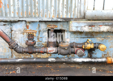 Old fuel transfer valves on a building in the industrial area of Portland Oregon Stock Photo