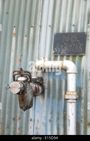 Old fuel transfer valves on a building in the industrial area of Portland Oregon Stock Photo