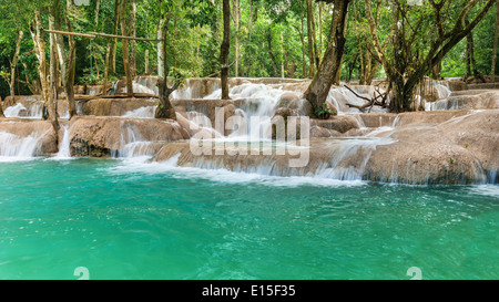 Jangle landscape with amazing turquoise water of Kuang Si cascade waterfall at tropical rain forest near Luang Prabang, Laos Stock Photo