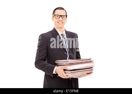 Smiling businessman holding a stack of documents Stock Photo