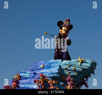 A Disney Parade with Micky Mouse dressed as  'The Sorcerer's Apprentice' from the Disney film Fantasia Stock Photo