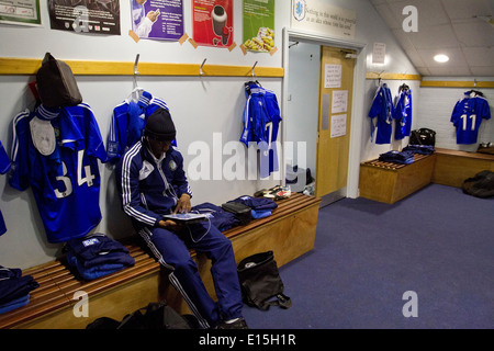 Micah Evans sitting in the home dressing room before Macclesfield Town host Gateshead at Moss Rose, Conference Premier League. Stock Photo