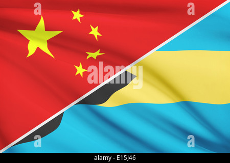 Flags of China and Commonwealth of the Bahamas blowing in the wind. Part of a series. Stock Photo