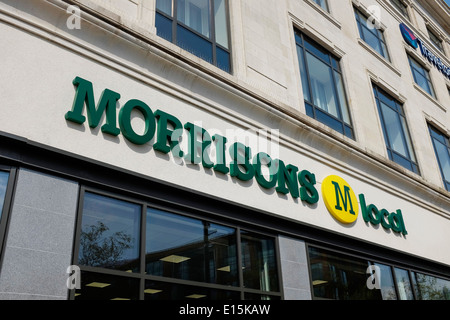 Morrisons M Local store sign in Manchester Piccadilly Gardens UK Stock Photo