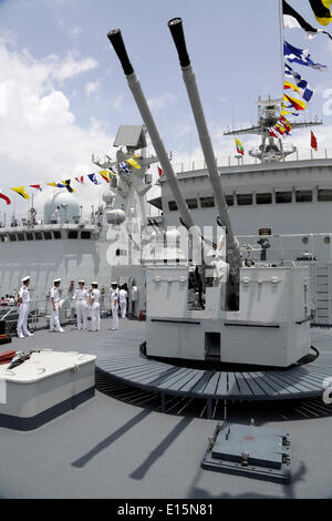 Yangon, Myanmar. 23rd May, 2014. Chinese Navy soldiers are seen on the deck of a Chinese naval vessel at Thilawa Port in Yangon, Myanmar, May 23, 2014. Two Chinese naval ships, Zheng He training vessel and Wei Fang defense vessel, called at the Myanmar International Terminals Thilawa (MITT) in Yangon Friday morning for their second leg of Asian voyage. Credit:  U Aung/Xinhua/Alamy Live News Stock Photo