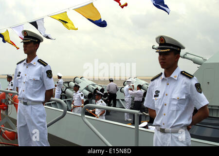 Yangon, Myanmar. 23rd May, 2014. Chinese Navy soldiers stand on the deck of a Chinese naval vessel at Thilawa Port in Yangon, Myanmar, May 23, 2014. Two Chinese naval ships, Zheng He training vessel and Wei Fang defense vessel, called at the Myanmar International Terminals Thilawa (MITT) in Yangon Friday morning for their second leg of Asian voyage. Credit:  U Aung/Xinhua/Alamy Live News Stock Photo