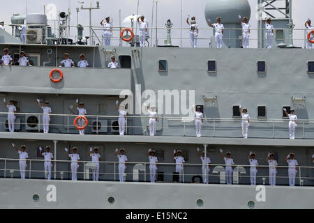 Yangon, Myanmar. 23rd May, 2014. Chinese Navy soldiers wave on the deck of a Chinese naval vessel at Thilawa Port in Yangon, Myanmar, May 23, 2014. Two Chinese naval ships, Zheng He training vessel and Wei Fang defense vessel, called at the Myanmar International Terminals Thilawa (MITT) in Yangon Friday morning for their second leg of Asian voyage. Credit:  U Aung/Xinhua/Alamy Live News Stock Photo