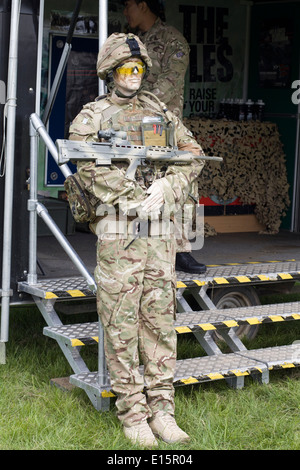 Male Mannequin Dressed in Army combat gear with assault riffle at a military show Stock Photo